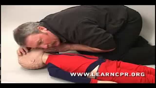 demonstration of proper CPR for a child